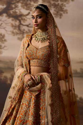 Buy_ANGAD SINGH_Orange Silk Sweetheart Neck Kesar Raw Bridal Lehenga Set _Online_at_Aza_Fashions