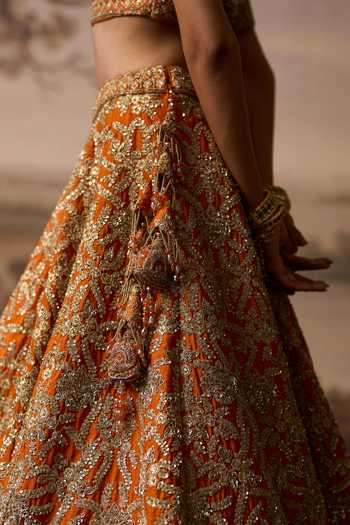 ANGAD SINGH_Orange Silk Sweetheart Neck Kesar Raw Bridal Lehenga Set _at_Aza_Fashions