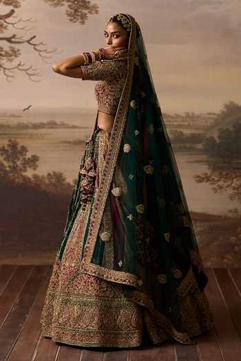 Shop_ANGAD SINGH_Emerald Green Silk V-neck Raavi Raw Bridal Lehenga Set _at_Aza_Fashions