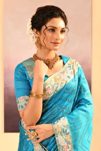 singhanias_Turquoise Silk Raw Saree With Running Blouse Fabric _at_Aza_Fashions