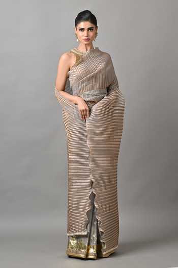 Kiran Uttam Ghosh_Gold Polyester Smoky Pleated Saree With Unstitched Blouse Piece _Online_at_Aza_Fashions