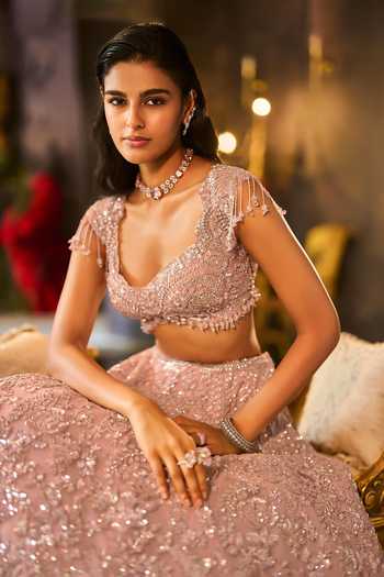 Seema Gujral_Peach Net Sweetheart Neck Dusty Sequin Bridal Lehenga Set _Online_at_Aza_Fashions