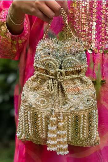 Buy_SG Collection By Sonia Gulrajani_Gold Pearls, Stones, Mirrors, Crystals, Tassels Diya Embellished Potli _at_Aza_Fashions