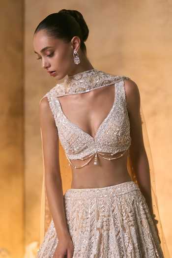 Angad Singh_Gold Net V-neck Vermeil Tonal Crystal Embroidered Lehenga Set _at_Aza_Fashions