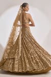 Shop Seema Gujral Gold Net Floral Notched Sequin Work Scallop Pattern Bridal Lehenga Set at Aza Fashions Shop_Seema Gujral_Gold Net Floral Notched Sequin Work Scallop Pattern Bridal Lehenga Set_at_Aza_Fashions