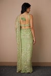 Shop_Astha Narang_Green Net Embroidered Nakshi Scoop Neck Sequin Saree With Blouse For Women_at_Aza_Fashions