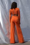 Shop_ZWAAN_Orange Lycra Plain V Neck Draped Cut-out Jumpsuit _at_Aza_Fashions