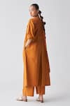 Shop_Three_Orange Poplin Round Neck Pleated Back Jacket _at_Aza_Fashions