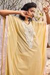 Shop Charkhee Yellow Cotton Beads, Cut Work V-neck Stripe Pattern Embellished Kaftan at Aza Fashions Shop_Charkhee_Yellow Cotton Beads, Cut Work V-neck Stripe Pattern Embellished Kaftan_at_Aza_Fashions