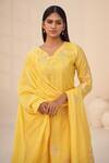 Shop_Hirika & Dhruti_Yellow Cotton, Silk, Organza Embroidery, Tassels V-neck Floral Kurta Set _at_Aza_Fashions