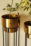 Shop_Kaksh Studio_Gold Aluminium And Iron Noir Planter With Stand Set Of 2_at_Aza_Fashions