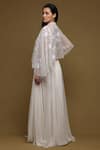 Shop Shriya Som Ivory Tulle, Crepe, Chiffon Pleated Lehenga And Floral Embroidered Capelet Set at Aza Fashions Shop_Shriya Som_Ivory Tulle, Crepe, Chiffon Pleated Lehenga And Floral Embroidered Capelet Set _at_Aza_Fashions