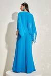 Shop_NAMRATA JOSHIPURA_Blue Georgette Hand Embellished Floral Patterns Round Wisteria Cape Jumpsuit_at_Aza_Fashions