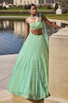 Shop_Seema Gujral_Green Net Embroidery Sequin One Shoulder Blouse And Lehenga Set _at_Aza_Fashions