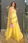 Shop_Nitisha Kashyap Official_Yellow Georgette, Net, Silk Sequins, Beads, Floral Embroidered Kurta Sharara Set _at_Aza_Fashions