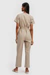 Shop_Reistor_Beige Poplin V Neck Solid Front Tie-up Jumpsuit  _at_Aza_Fashions