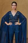 Shop Studio Radical Blue Crepe, Georgette Beads V-neck Cape Sleeved Embellished Slit Jumpsuit at Aza Fashions Shop_Studio Radical_Blue Crepe, Georgette Beads V-neck Cape Sleeved Embellished Slit Jumpsuit _at_Aza_Fashions