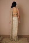 Shop_Astha Narang_Off White Net Embroidered Nakshi Scoop Neck Sequin Saree With Blouse For Women_at_Aza_Fashions
