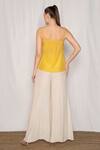 Shop_Amrta By Guneet Kondal_Yellow Viscose Pearls, Beads, Zari Scoop Neck Embroidered Top And Flared Pant Set _at_Aza_Fashions