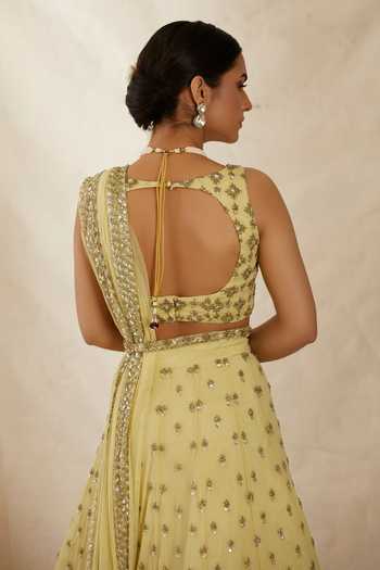 Shop_ASTHA NARANG_Yellow Net, Crepe, Nylon Embroidery, Cut Work, Flower Bridal Lehenga Set _at_Aza_Fashions