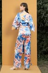 Shop_Mandira Wirk Resort_Blue Satin Hawaii Print V Neck Wrap Top And Bell Bottom Set_at_Aza_Fashions