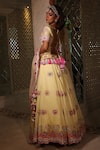 Shop_XOXO Apurva_Yellow Satin Organza Embroidered Floral Boat Carnival Lehenga Set  _at_Aza_Fashions