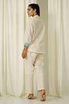 Shop Sakshi Khetterpal Ivory Chanderi Beads, Pearls, Embroidery Collared Shirt And Pant Set at Aza Fashions Shop_Sakshi Khetterpal_Ivory Chanderi Beads, Pearls, Embroidery Collared Shirt And Pant Set _at_Aza_Fashions