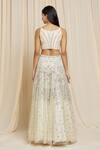 Shop_Izzumi Mehta_Ivory Net Embroidered Floral Round Hand Lehenga Choli Set _at_Aza_Fashions