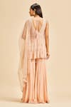 Shop_Nitika Gujral_Peach Peplum Top And Sharara Georgette & Dupatta Net Embroidery Sequin Set _at_Aza_Fashions