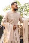 Shop_Decemberbyvivek_Beige Silk Hand Embroidery Floral All Over Leaf Sherwani Set _at_Aza_Fashions