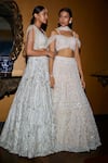 Shop_Nadine Dhody_White Tulle Embroidery Beads Illusion Neck Sequin Lehenga Set  _at_Aza_Fashions