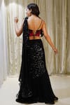 Shop_Archana Kochhar_Black Georgette Embroidered Sequins Cosmic Pre-stitched Skirt Saree With Blouse _at_Aza_Fashions