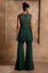 Shop_OMANA BY RANJANA BOTHRA_Emerald Green Peplum - Crinkled Pankhi Zardozi Top And Bell Bottom Pant Set _at_Aza_Fashions