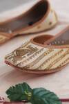 Shop_Stitched Soles_Off White Embellished Gold Dust Embroidered Juttis_at_Aza_Fashions