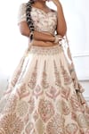 Shop_Pallavi Poddar_Ivory Silk, Tulle Embroidery Boat Neck Vrinda Mughal Bridal Lehenga Set _at_Aza_Fashions