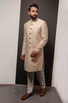 Shop_Darshika Menswear_Beige Silk Embroidery Textured Pattern Long Bandhgala Set_at_Aza_Fashions
