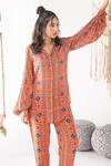 Shop_Chhavvi Aggarwal_Orange Crepe Collared Stripe Print Shirt _at_Aza_Fashions