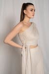 AMRTA by GUNEET KONDAL_Off White Embroidery Metallic Yarn Asymmetric Draped Top And Flared Pant Set _at_Aza_Fashions