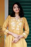 Shop_TINA EAPEN COLLECTIVE_Yellow Cotton Silk Woven Floral V Neck Kurta And Pant Set _Online_at_Aza_Fashions