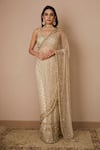 Astha Narang_Off White Net Embroidered Nakshi Scoop Neck Sequin Saree With Blouse For Women_Online_at_Aza_Fashions