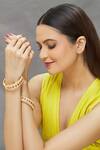 Saga Jewels Gold Plated Pearls, Diamonds Embellished Bangles - Set Of 2 Online at Aza Fashions Saga Jewels_Gold Plated Pearls, Diamonds Embellished Bangles - Set Of 2_Online_at_Aza_Fashions