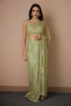 Astha Narang_Green Net Embroidered Nakshi Scoop Neck Sequin Saree With Blouse For Women_Online_at_Aza_Fashions