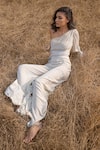 AMRTA by GUNEET KONDAL_Off White Embroidery Metallic Yarn Asymmetric Draped Top And Flared Pant Set _Online_at_Aza_Fashions