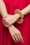 Shop_Just Shradhas_Gold Plated Pearls, Beads, Diamonds Polki Kundan Drop Bangle _Online_at_Aza_Fashions
