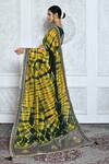 Shop_Samyukta Singhania_Yellow Satin Silk Tie Dye Pattern Saree_at_Aza_Fashions