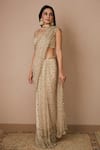 Astha Narang_Off White Net Embroidered Nakshi Scoop Neck Sequin Saree With Blouse For Women_at_Aza_Fashions