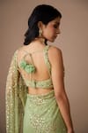 Astha Narang_Green Net Embroidered Nakshi Scoop Neck Sequin Saree With Blouse For Women_at_Aza_Fashions