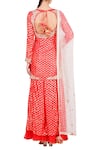 Shop_Nikasha_Red Foil Print Lotus Round Short Kurta With Sharara And Dupatta For Women_at_Aza_Fashions
