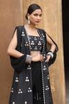 Shop_Nitisha Kashyap Official_Black Georgette, Silk Mirrors, Beads Square Floral Embroidered Cape Gharara Set _Online_at_Aza_Fashions