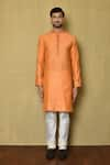 Shop_Arihant Rai Sinha_Orange Banarasi Jamewar Woven Floral Mandarin Collar Kurta And Churidar _Online_at_Aza_Fashions